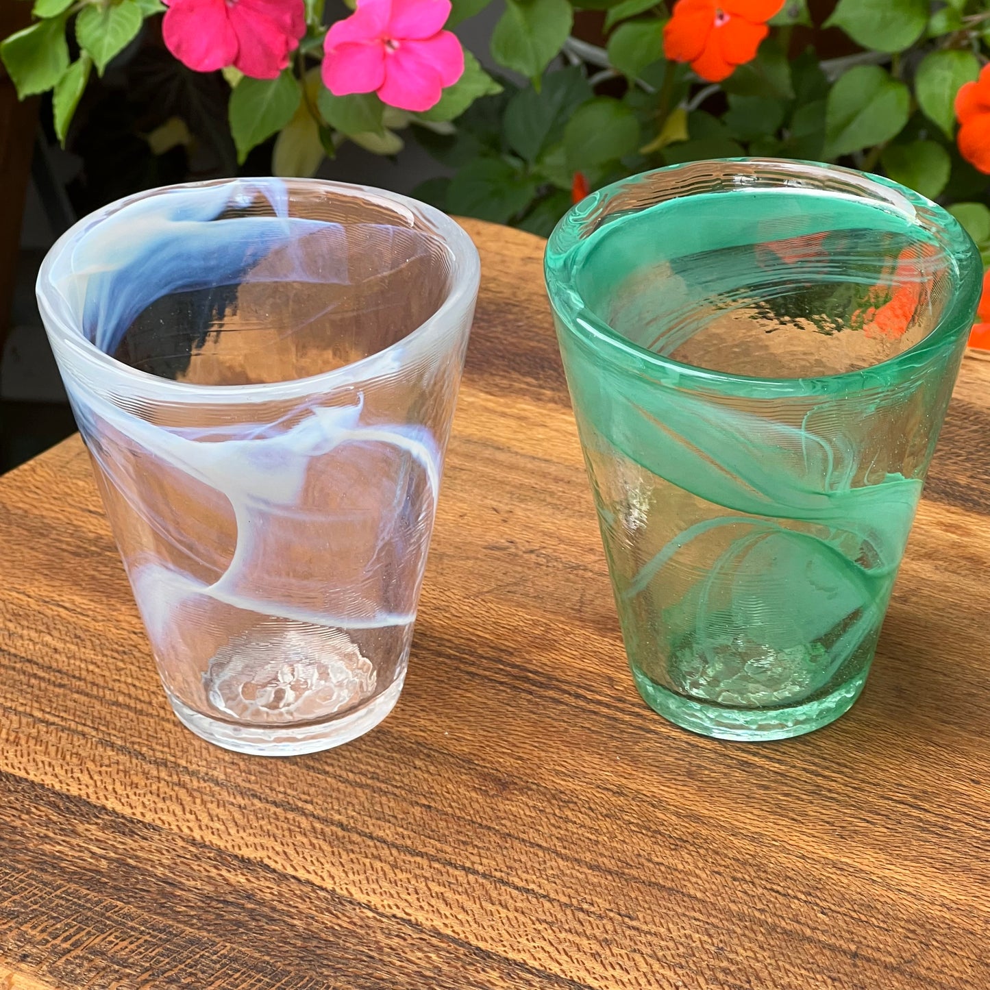 Two Kosta Boda Ulrica Hydman Vallien Soft White and Soft Green Tumblers