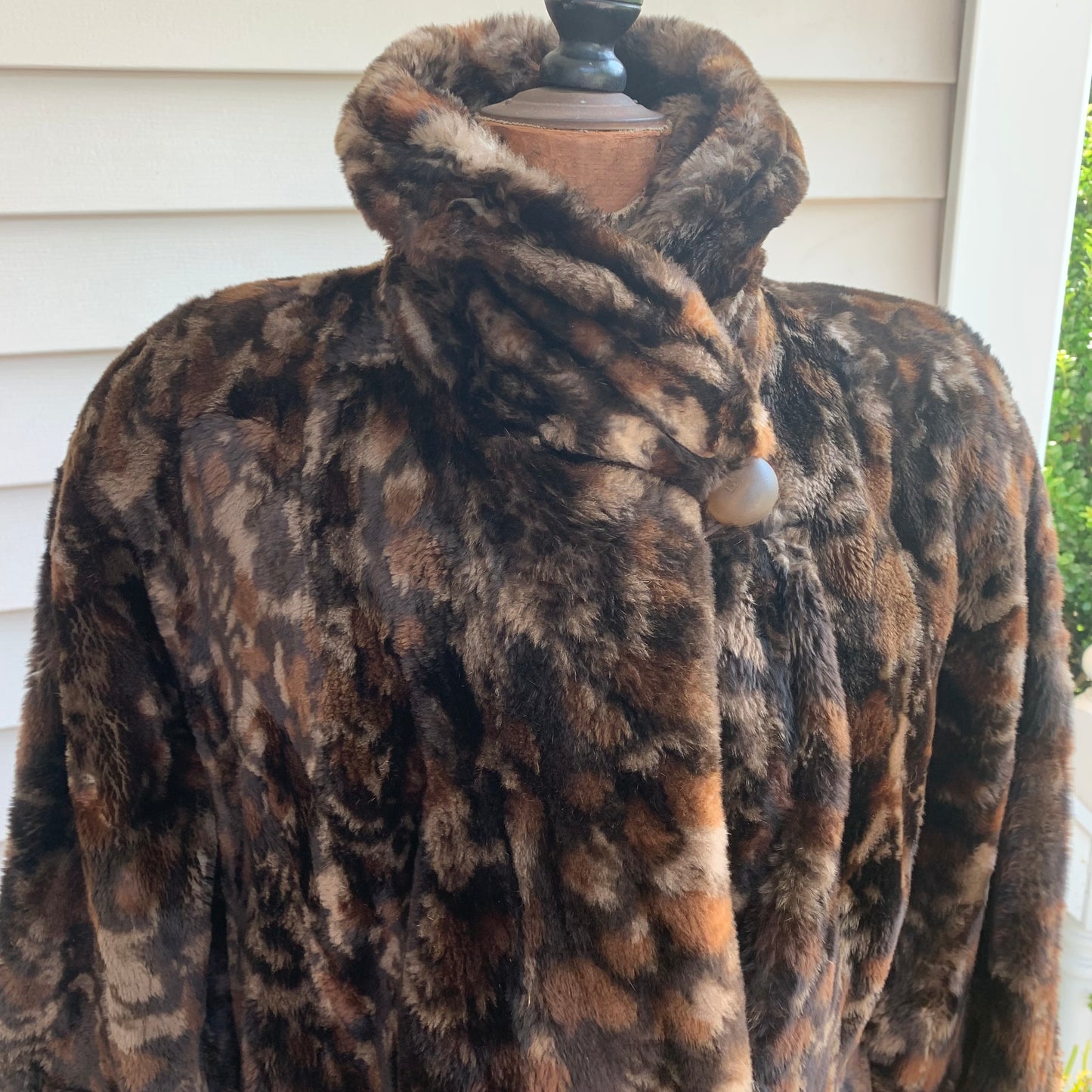 Attractive multi color Fendi wrapped tight at the neck.