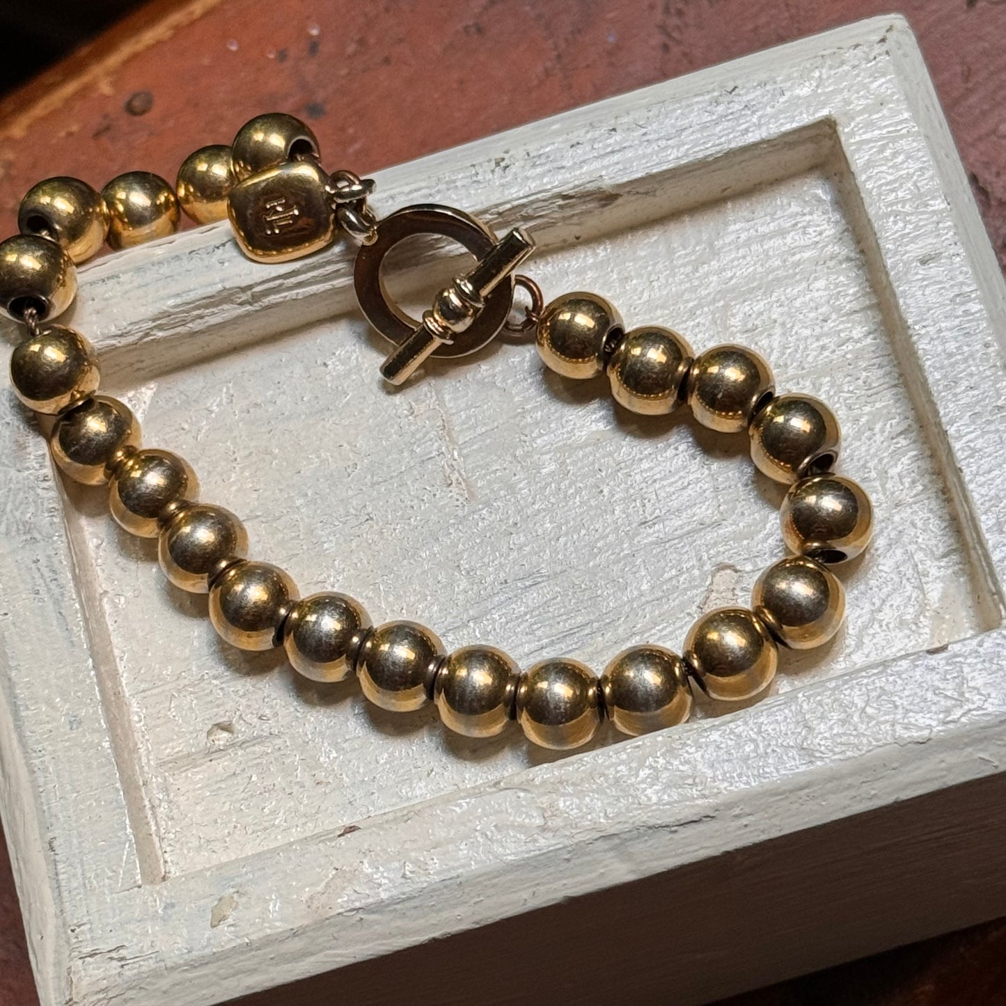 Ralph Lauren Hefty Gold Plated Round Bead Toggle Bracelet